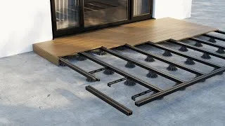 Early stage of deck construction featuring a durable metal framing system laid out on a concrete base, ready for composite decking installation, emphasizing structural integrity and modern building techniques.