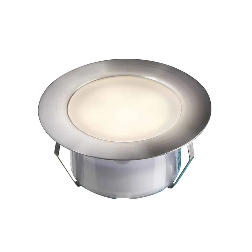 Modern round LED deck light with a brushed metal finish, providing soft, diffused lighting ideal for creating a welcoming atmosphere on composite decks.